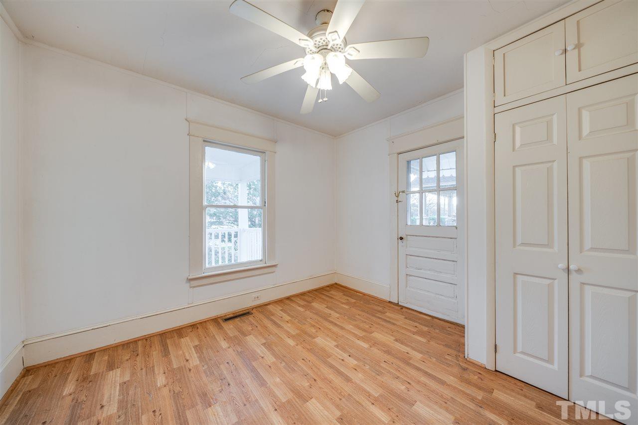 3133 Stanhope Avenue Raleigh, NC 27607 - Photo 17 of 21 an empty room with windows and fan
