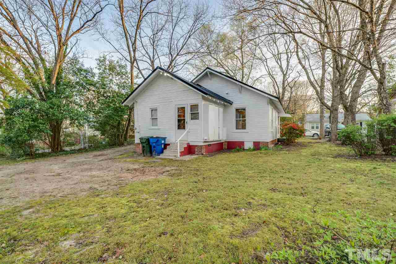 3133 Stanhope Avenue Raleigh, NC 27607 - Photo 21 of 21 a view of a house with a yard and garage