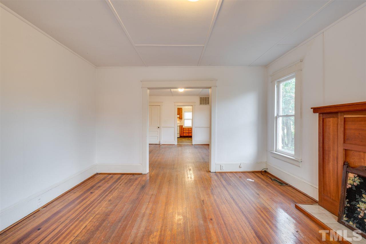 3133 Stanhope Avenue Raleigh, NC 27607 - Photo 4 of 21 a view of empty room with wooden floor and fan