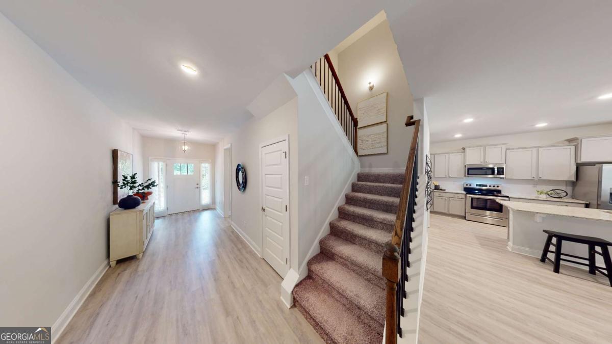 0 Maple Lane Williamson, GA 30292 - Photo 11 of 30 a view of a living room and entryway with wooden floor