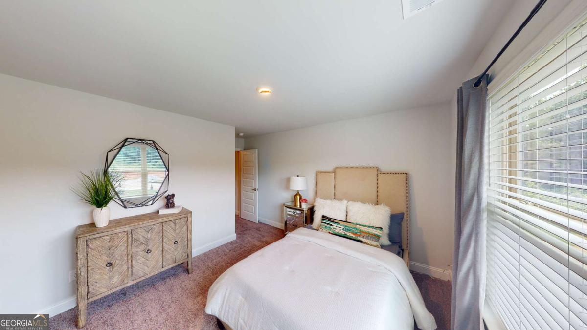 0 Maple Lane Williamson, GA 30292 - Photo 14 of 30 a bedroom with a bed window and a dresser