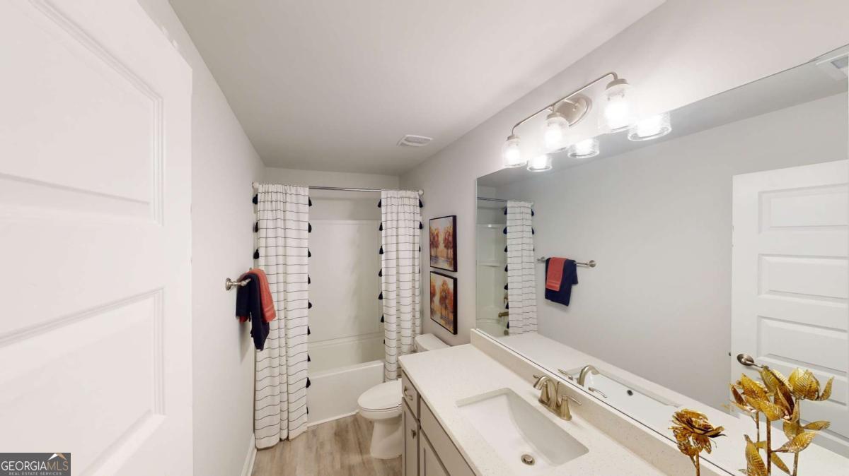 0 Maple Lane Williamson, GA 30292 - Photo 16 of 30 a bathroom with a sink mirror and shower