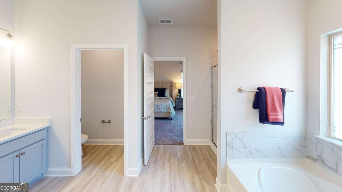 0 Maple Lane Williamson, GA 30292 - Photo 18 of 30 a bathroom with a tub and mirror
