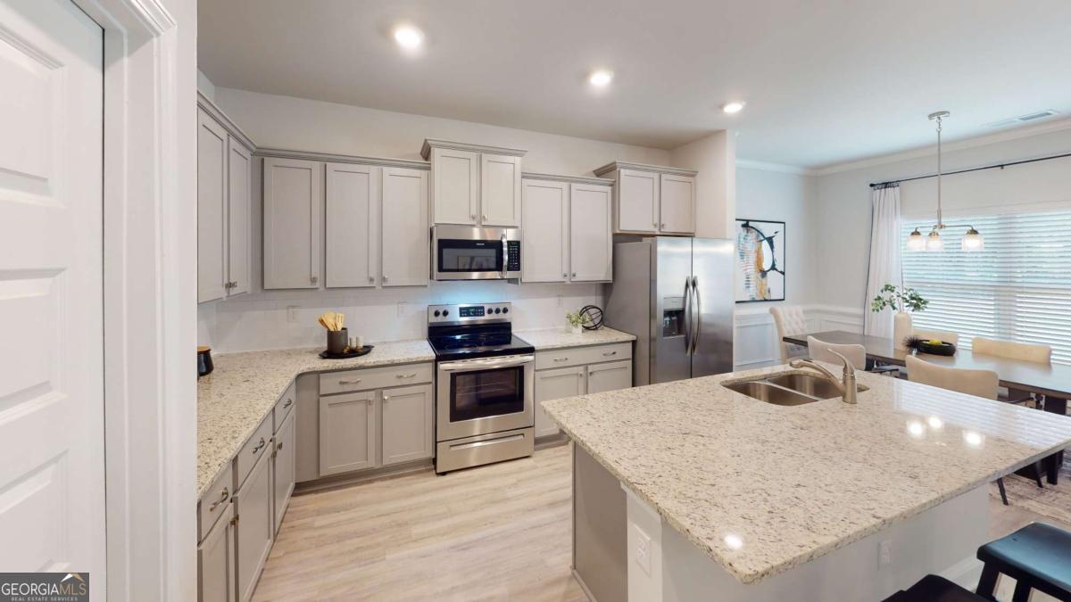 0 Maple Lane Williamson, GA 30292 - Photo 24 of 30 a kitchen with refrigerator a stove and cabinets