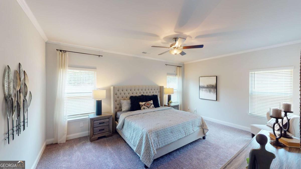 0 Maple Lane Williamson, GA 30292 - Photo 27 of 30 a bedroom with a bed and a chandelier