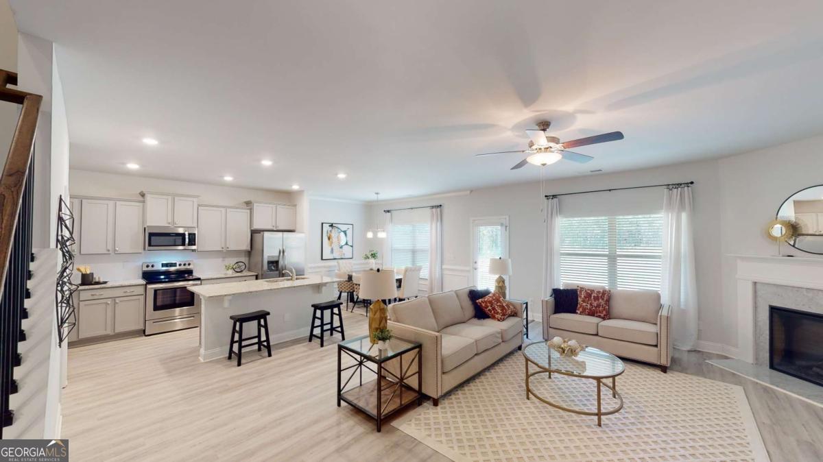 0 Maple Lane Williamson, GA 30292 - Photo 30 of 30 a living room with furniture white walls and kitchen view