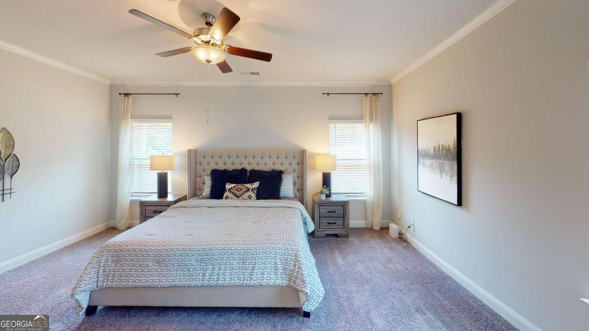 0 Maple Lane Williamson, GA 30292 - Photo 3 of 30 a bedroom with a bed and a chandelier