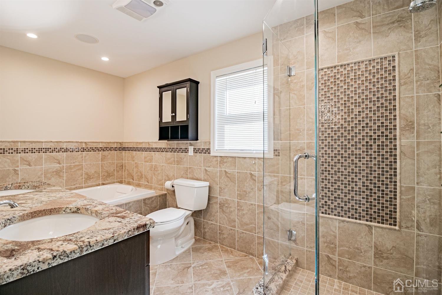 24 Kimberly Road Colonia, NJ 07067 - Photo 13 of 50 a bathroom with a granite countertop sink a toilet and shower
