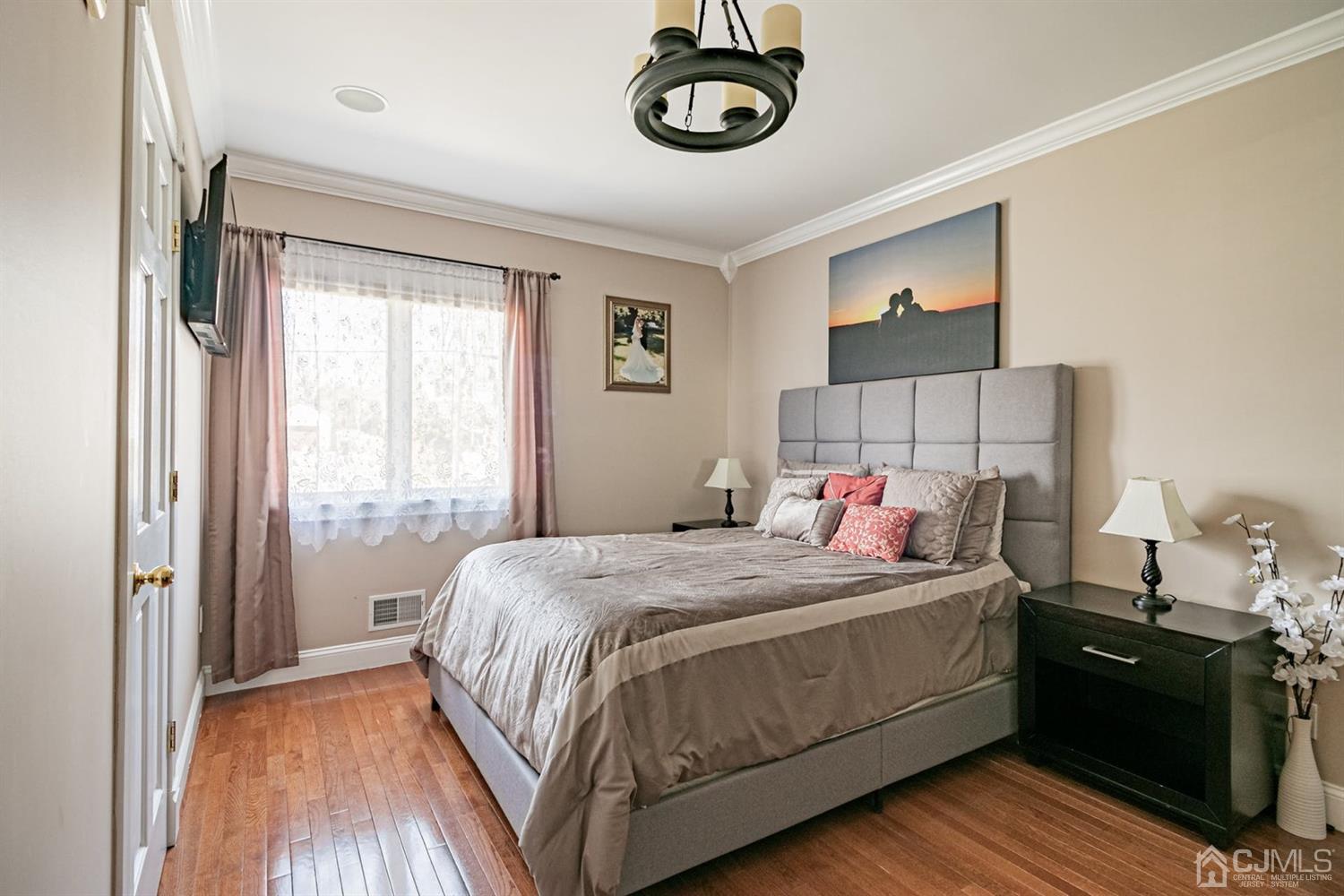 24 Kimberly Road Colonia, NJ 07067 - Photo 16 of 50 a bedroom with a bed and a window