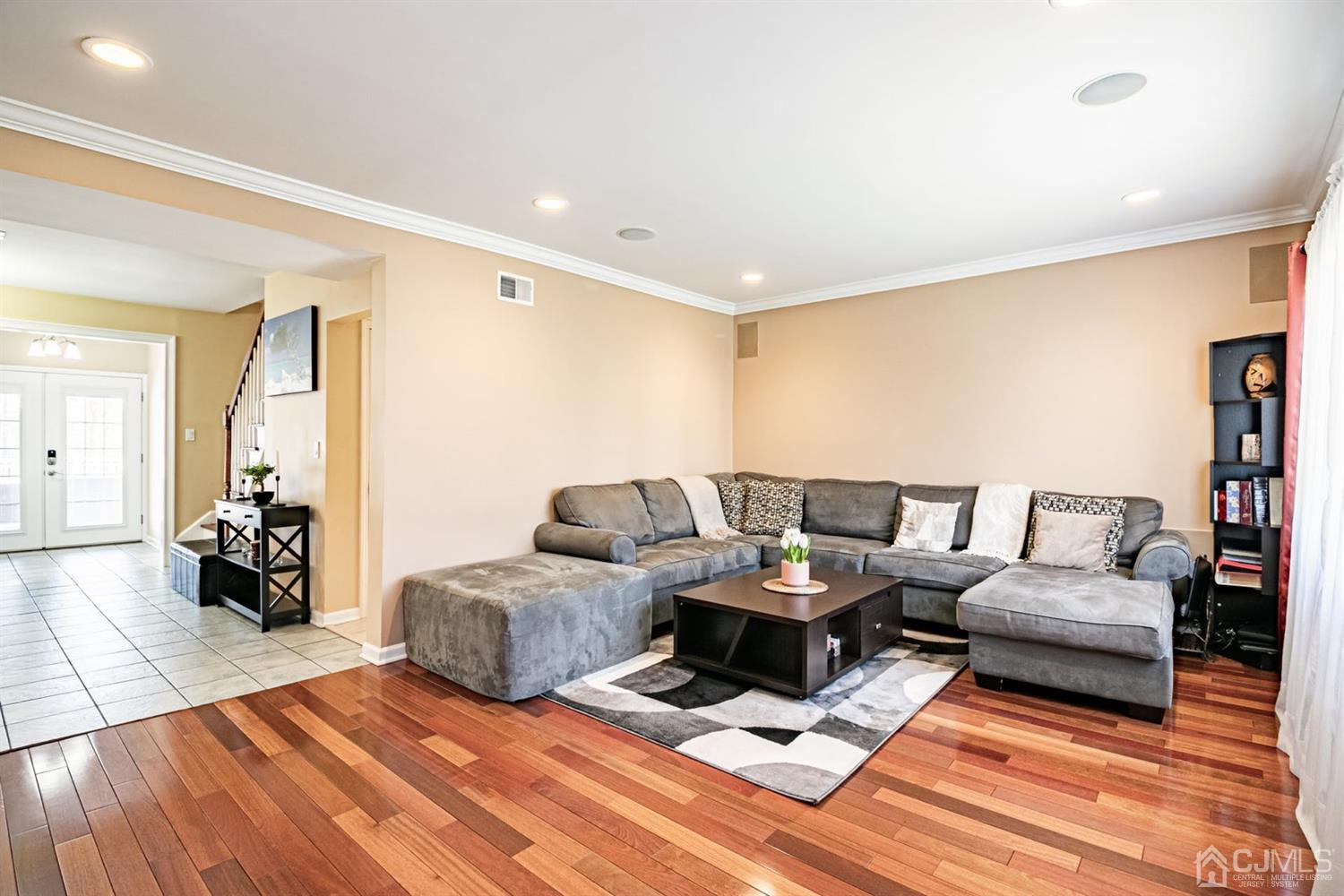 24 Kimberly Road Colonia, NJ 07067 - Photo 3 of 50 a living room with furniture and a wooden floor