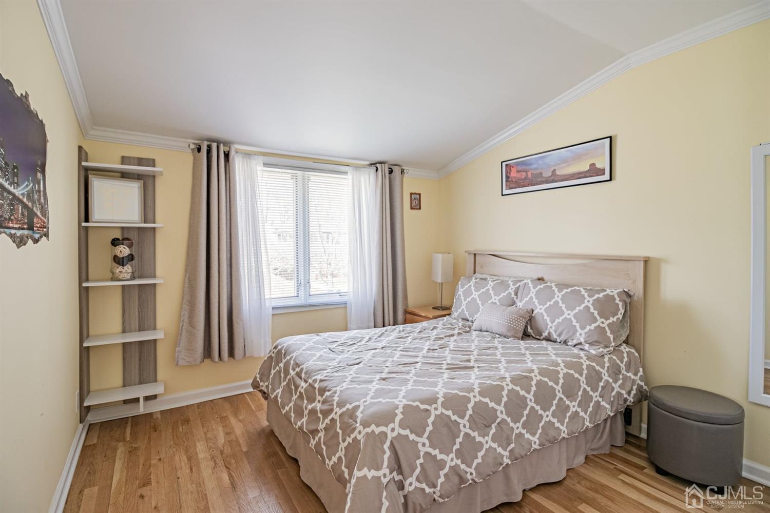 24 Kimberly Road Colonia, NJ 07067 - Photo 25 of 50 a bedroom with a large bed and a window