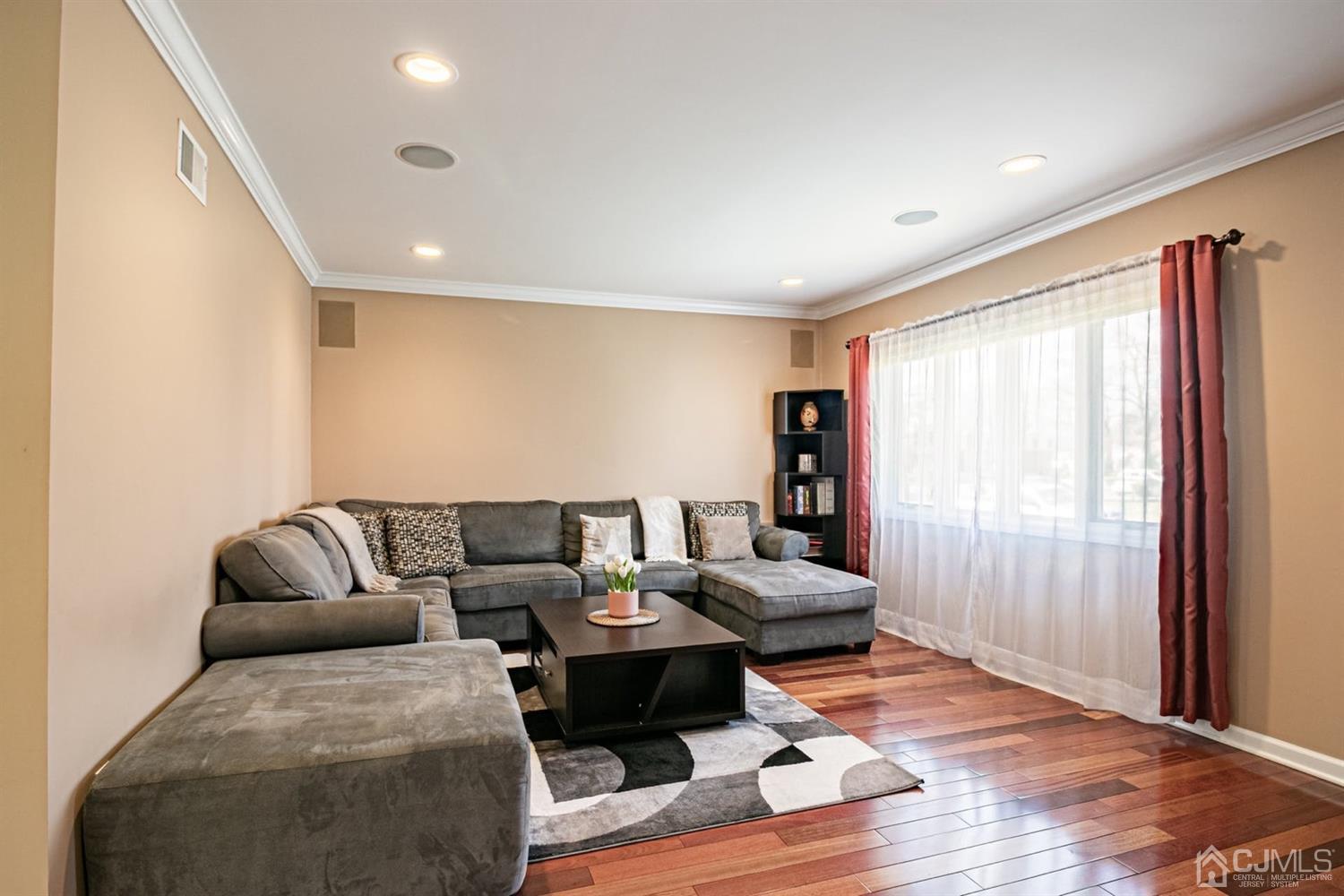 24 Kimberly Road Colonia, NJ 07067 - Photo 4 of 50 a living room with furniture and a large window