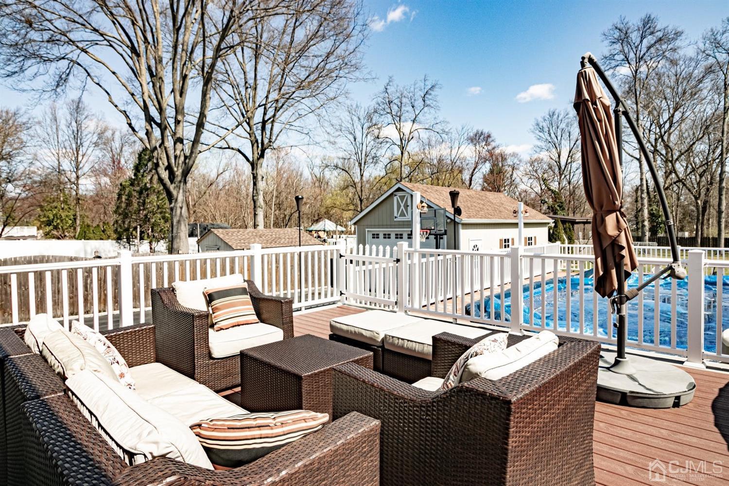 24 Kimberly Road Colonia, NJ 07067 - Photo 32 of 50 a view of a patio with a couch