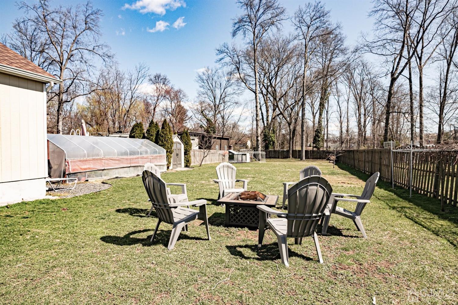 24 Kimberly Road Colonia, NJ 07067 - Photo 33 of 50 a view of backyard with swimming pool and outdoor seating