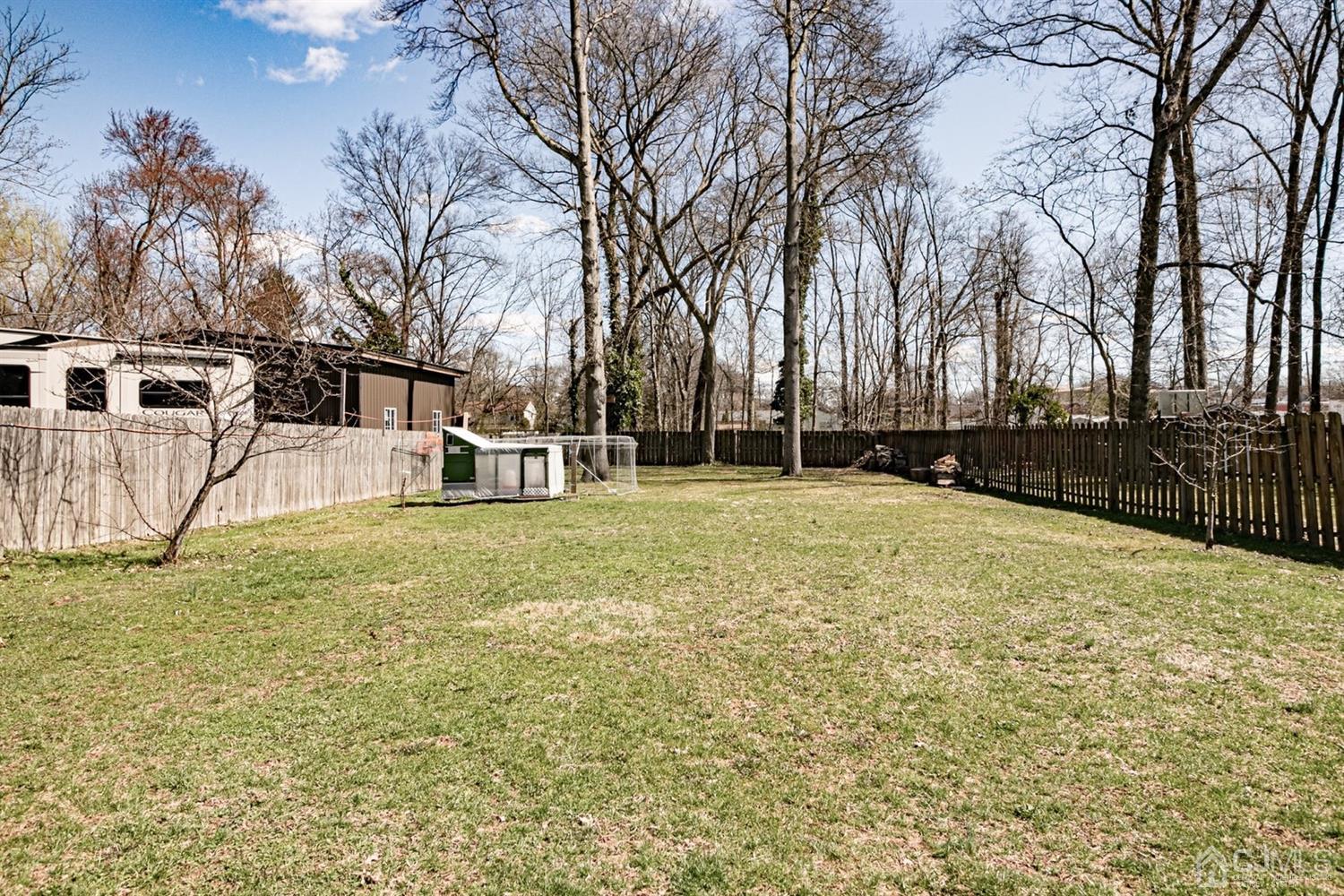 24 Kimberly Road Colonia, NJ 07067 - Photo 34 of 50 a house with trees in front of it