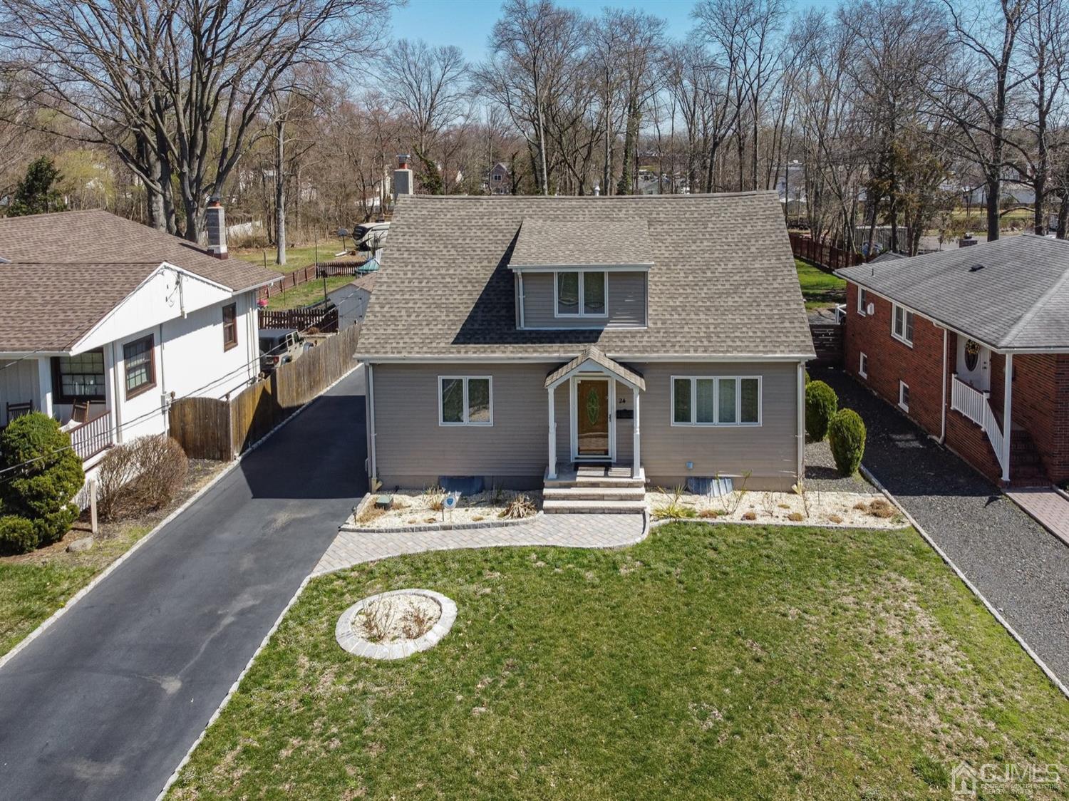 24 Kimberly Road Colonia, NJ 07067 - Photo 36 of 50 a aerial view of a house with swimming pool next to a yard