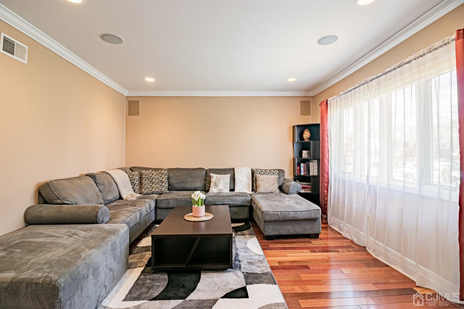 24 Kimberly Road Colonia, NJ 07067 - Photo 5 of 50 a living room with furniture and a large window
