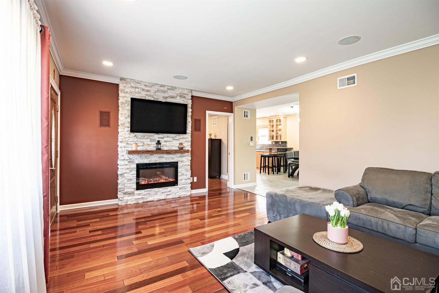 24 Kimberly Road Colonia, NJ 07067 - Photo 6 of 50 a living room with furniture and a flat screen tv