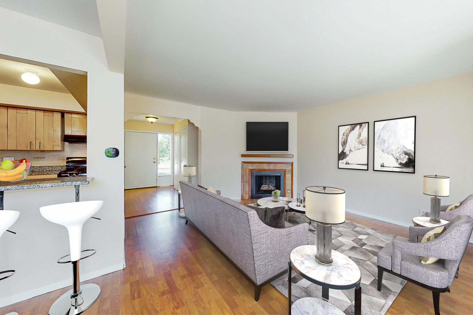 1009 Spring Mill Drive Hoffman Estates, IL 60169 - Photo 5 of 35 a living room with furniture a fireplace and a table