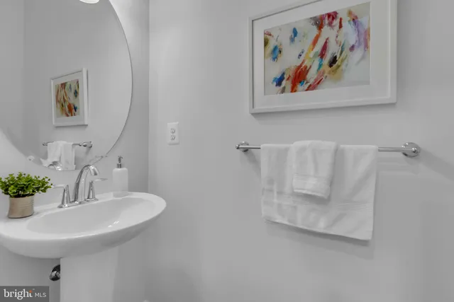 a bathroom with a sink and mirror