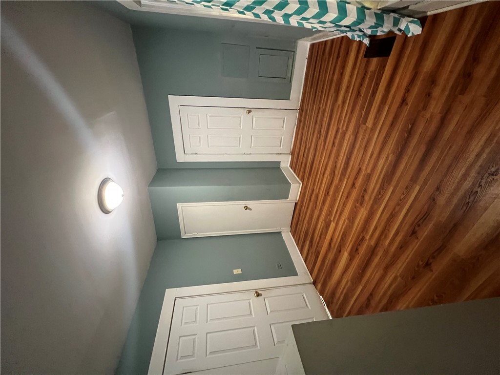 309 Jaynes Street Walhalla, SC 29691 - Photo 9 of 12 Rich hardwood-style flooring extends across this room, complemented by a convenient overhead light fixture.