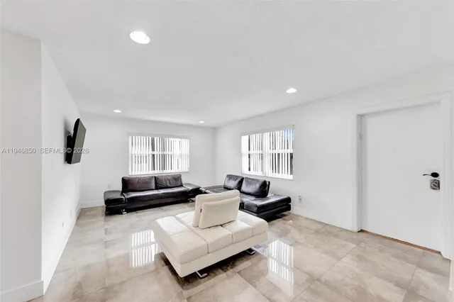 a living room with furniture and a window