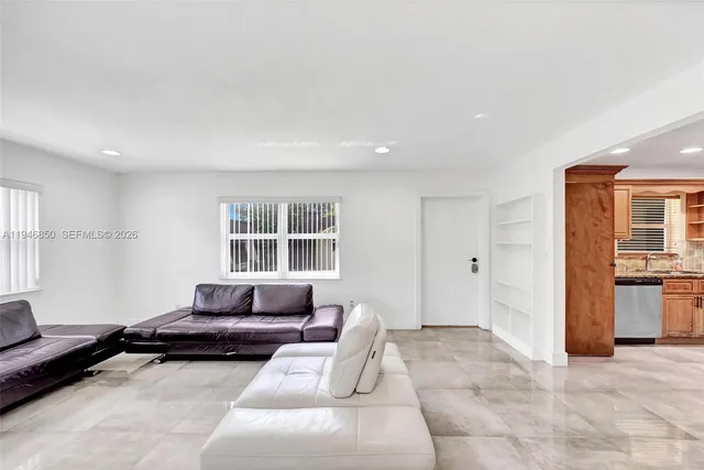 a living room with furniture and window