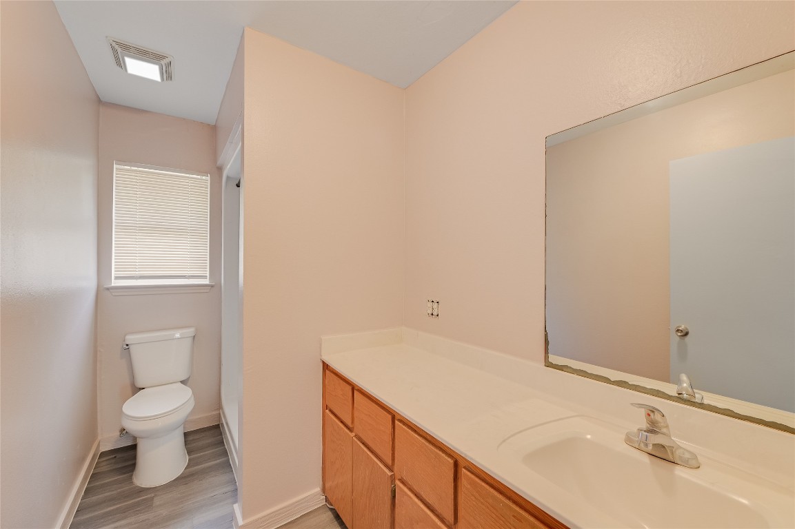 200 Creekside Trail Kyle, TX 78640 - Photo 16 of 19 a bathroom with a sink and a toilet