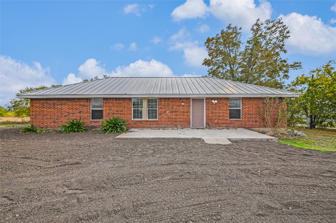 200 Creekside Trail Kyle, TX 78640 - Photo 3 of 19 a front view of a house with a yard and garage
