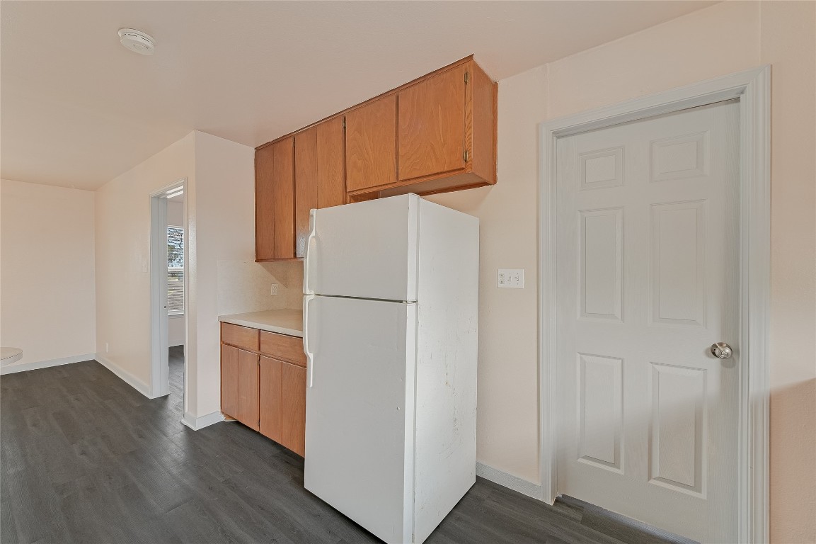 200 Creekside Trail Kyle, TX 78640 - Photo 5 of 19 a white refrigerator freezer sitting in a kitchen