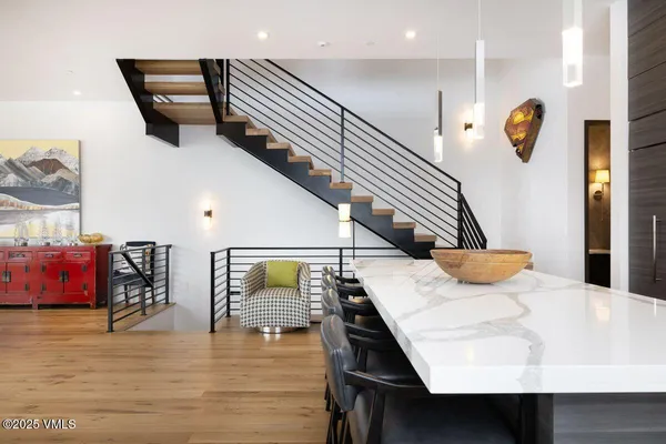 a kitchen with lots of counter space a sink and appliances