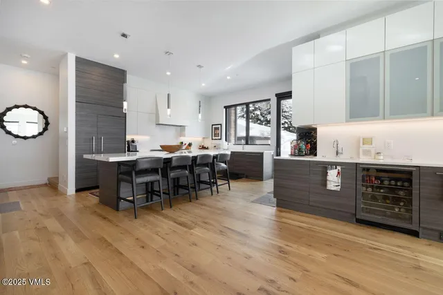 a kitchen with a sink stove top oven and cabinets