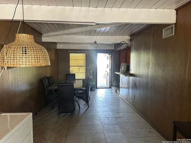 a view of a hallway with seating area