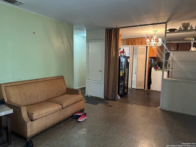 a living room with furniture and a couch