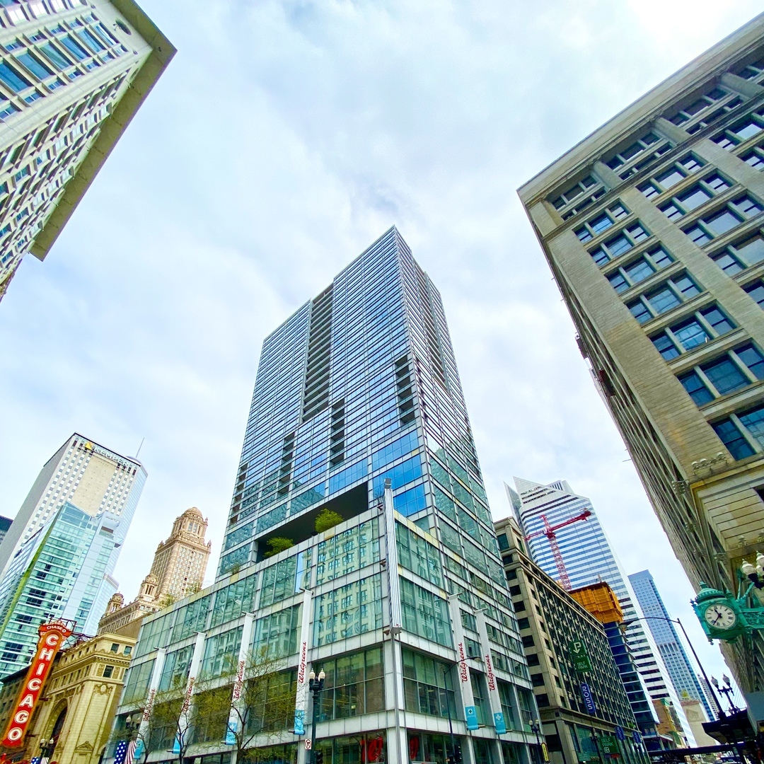 8 East Randolph Street, Unit 3207 Chicago, IL 60601 - Photo 1 of 16 a tall building with a window and a shower