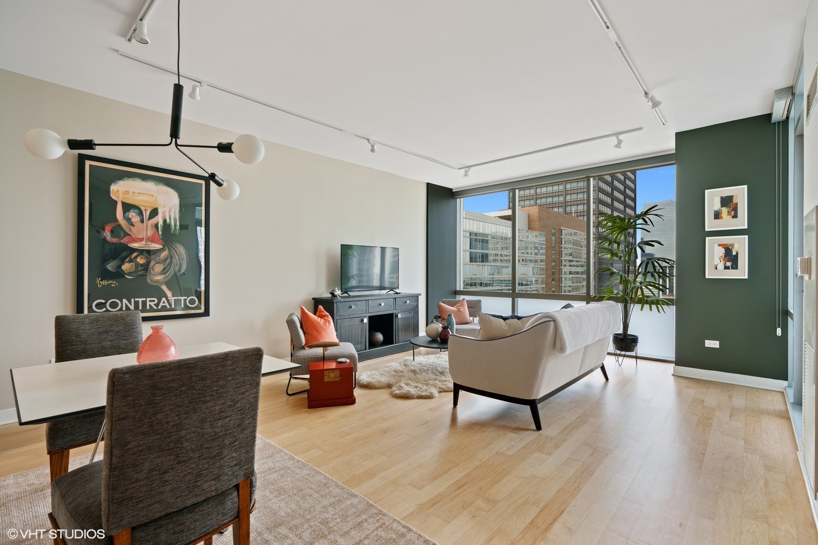 8 East Randolph Street, Unit 3207 Chicago, IL 60601 - Photo 3 of 16 a living room with furniture and a window