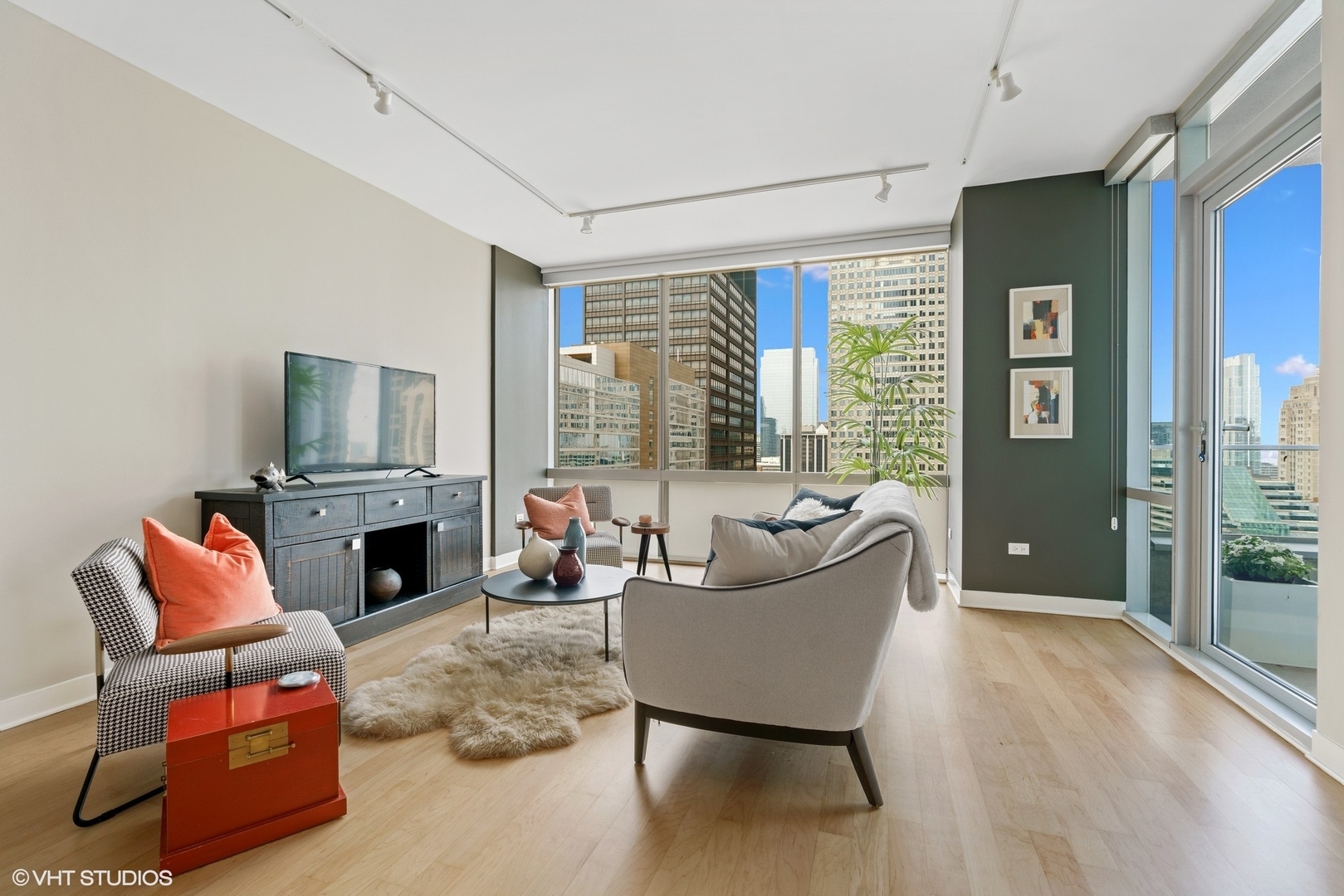 8 East Randolph Street, Unit 3207 Chicago, IL 60601 - Photo 4 of 16 a living room with furniture and a fireplace