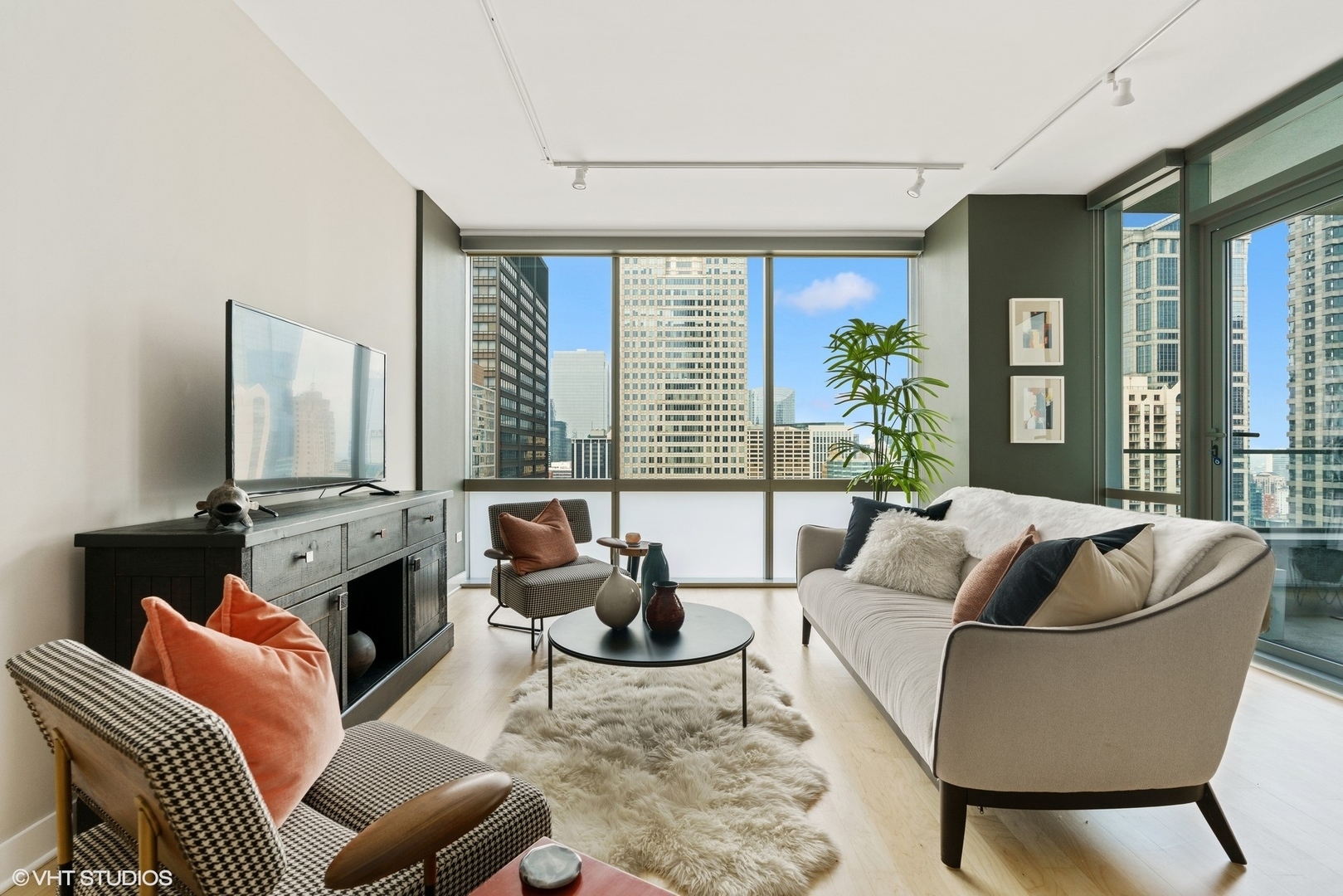 8 East Randolph Street, Unit 3207 Chicago, IL 60601 - Photo 5 of 16 a living room with furniture fireplace and large window
