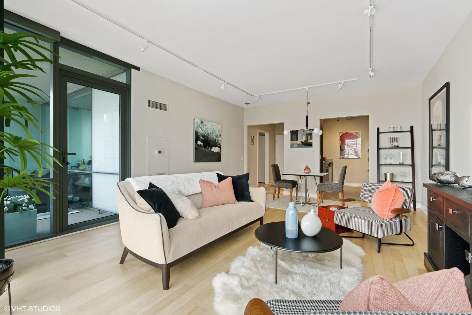 8 East Randolph Street, Unit 3207 Chicago, IL 60601 - Photo 6 of 16 a living room with furniture and wooden floor
