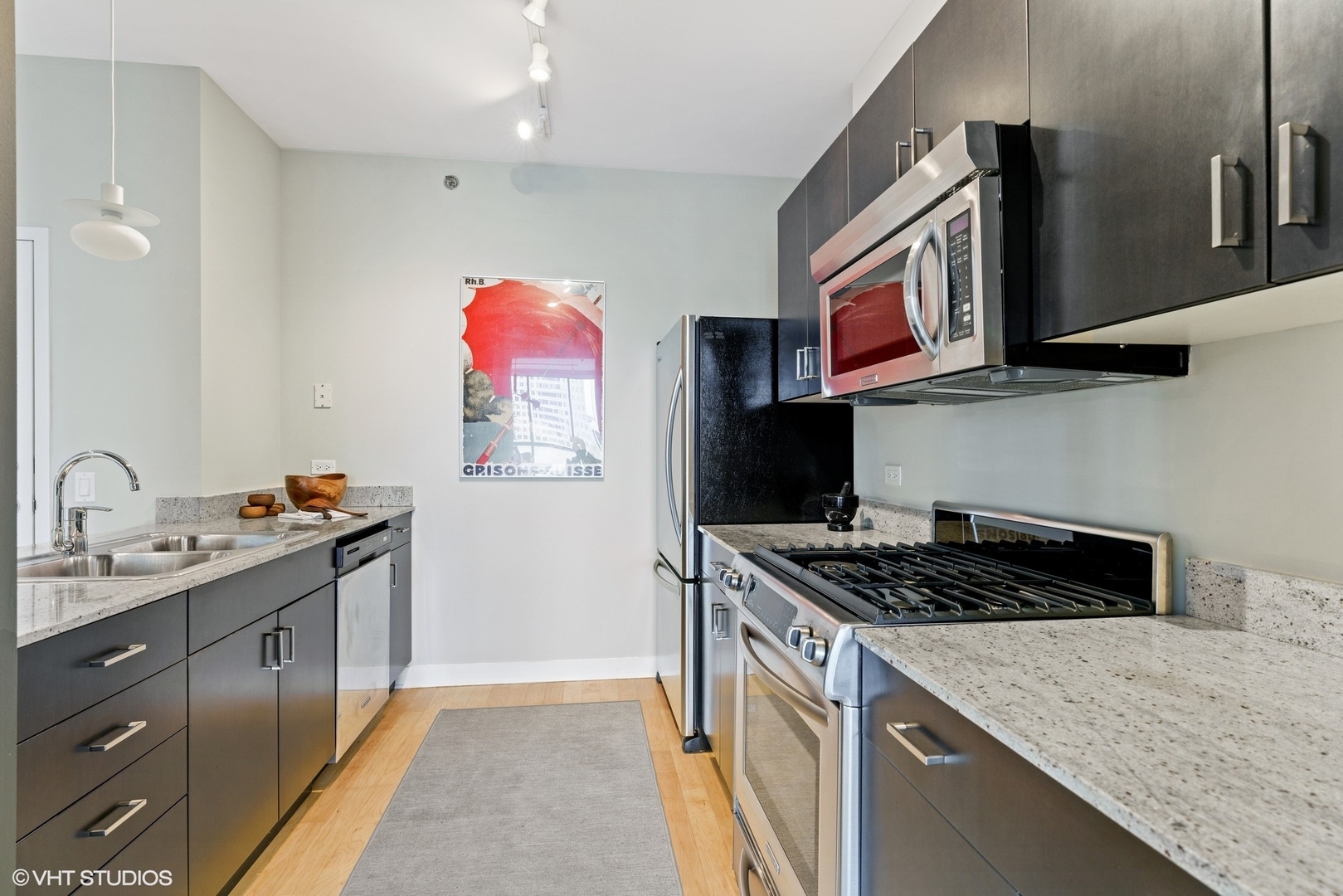 8 East Randolph Street, Unit 3207 Chicago, IL 60601 - Photo 7 of 16 a kitchen that has a sink and a stove