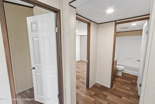 a bathroom with a glass shower door and a glass door