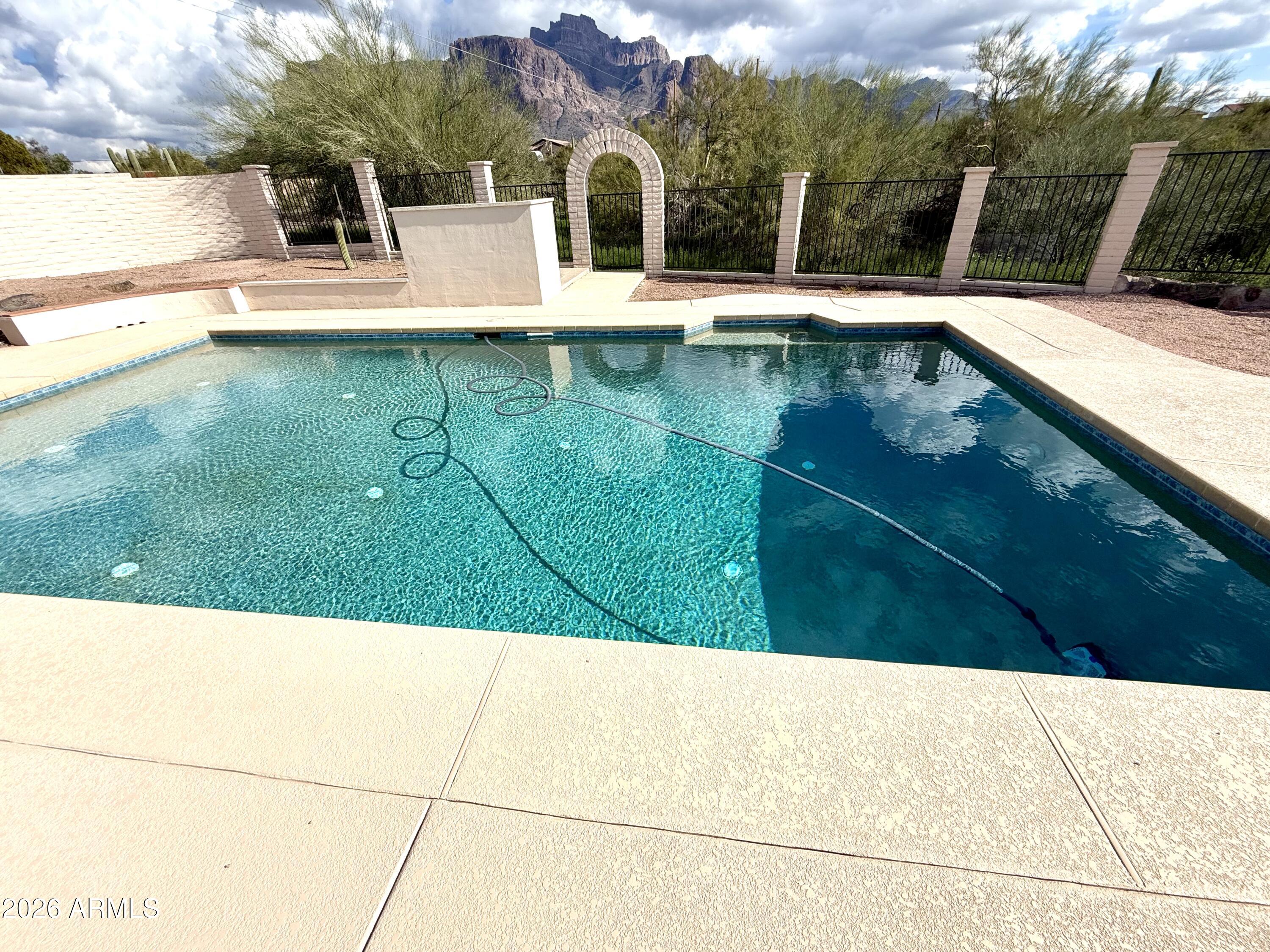 1165 North Mountain View Road Apache Junction, AZ 85119 - Photo 23 of 29 a view of an outdoor space and swimming pool