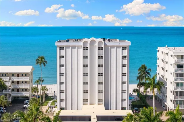 a view of a building with an outdoor space and seating area