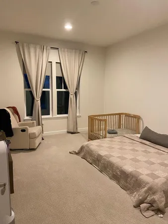 a view of a livingroom with furniture and staircase