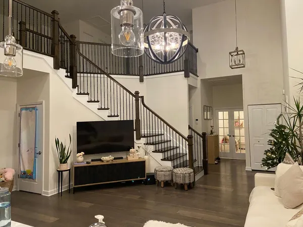 a living room with furniture and a flat screen tv