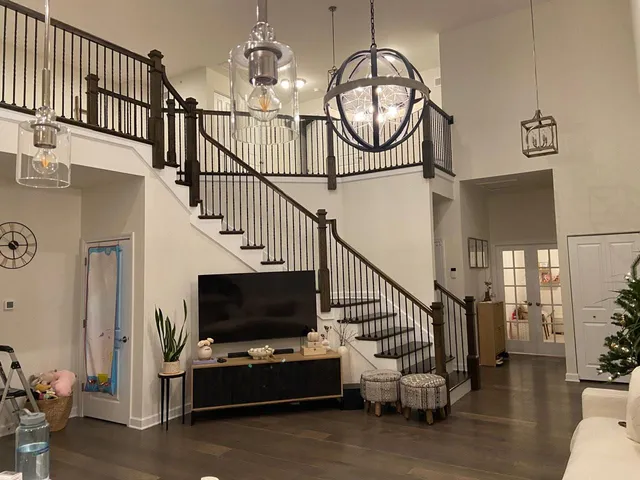 a view of entryway livingroom and hall with wooden floor