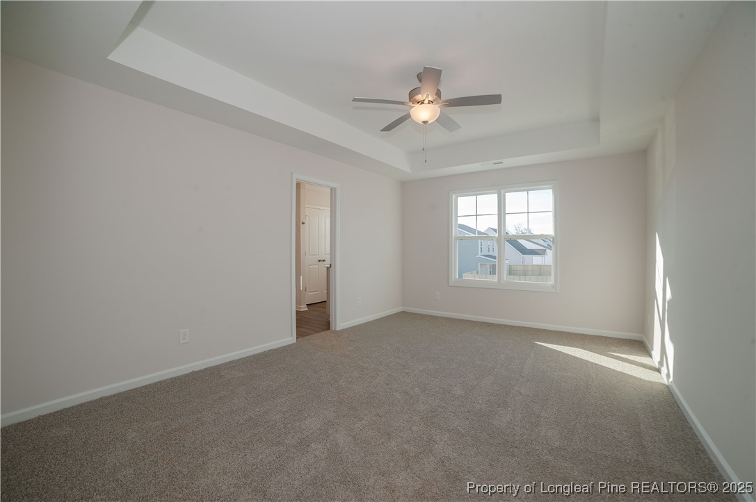 164 Ziggy Way Raeford, NC 28376 - Photo 12 of 25 an empty room with windows and fan
