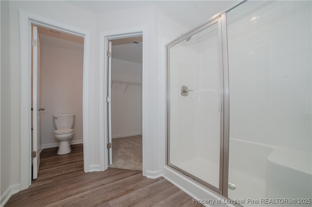 164 Ziggy Way Raeford, NC 28376 - Photo 24 of 25 a bathroom with a toilet and a shower