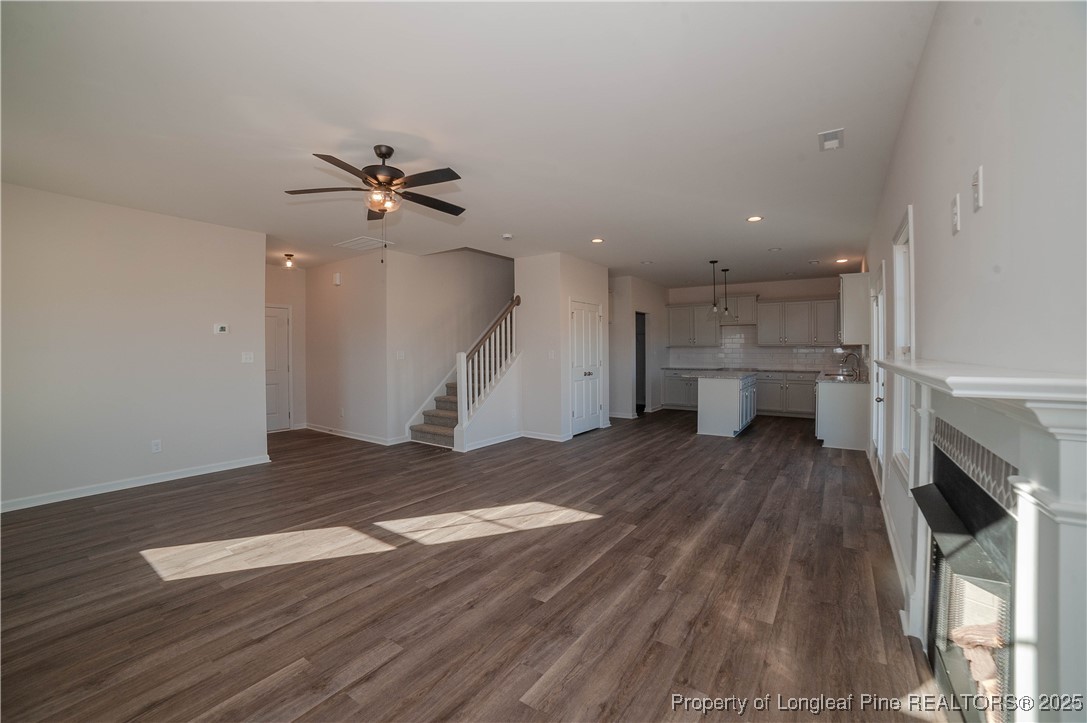 164 Ziggy Way Raeford, NC 28376 - Photo 8 of 25 a view of empty room with wooden floor and fireplace