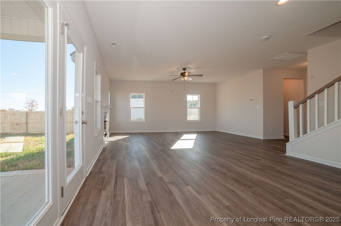 164 Ziggy Way Raeford, NC 28376 - Photo 9 of 25 a view of empty room with wooden floor and fan